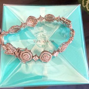 Sterling silver bracelet with hearts and butterflies.